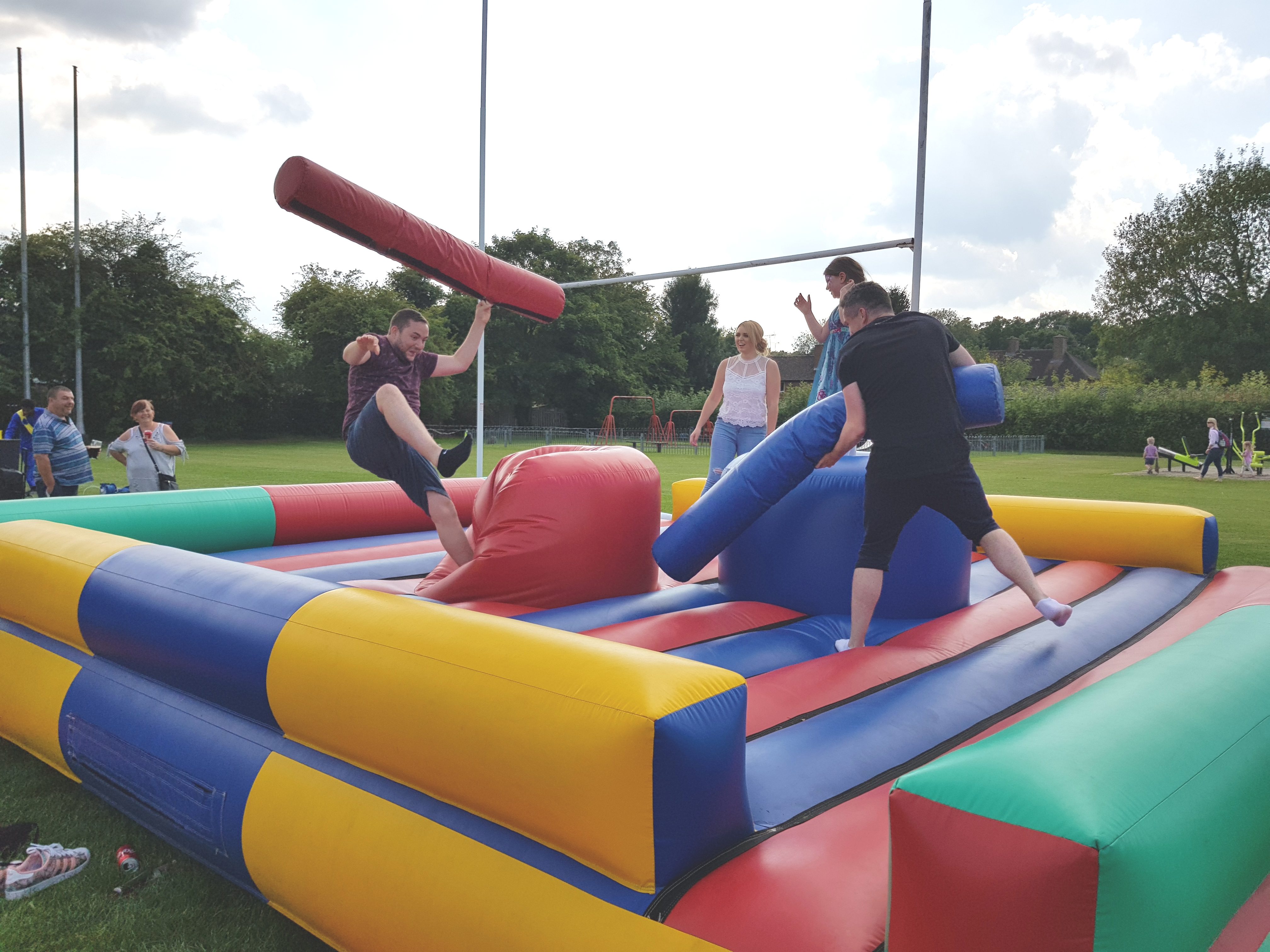 Simply Waste Solutions charity family fun day men on bouncy castle